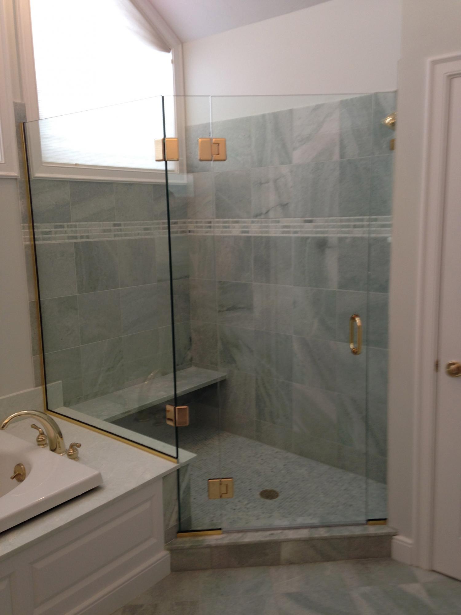Bathroom remodel, we replaced the tile, rebuilt structure where needed and painted walls and wood work (shower door installed by Grow Glass Co.)